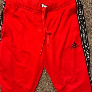 Adidas (the brand with the three strips) pants
